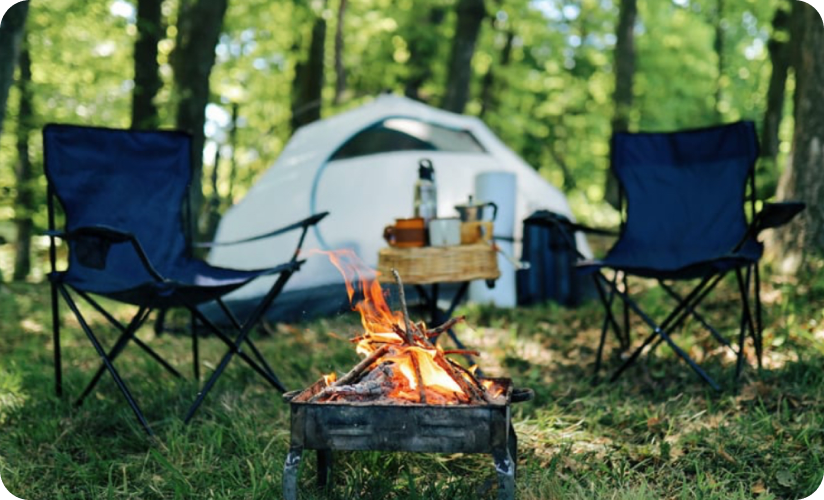 A tent next to chairs under shade